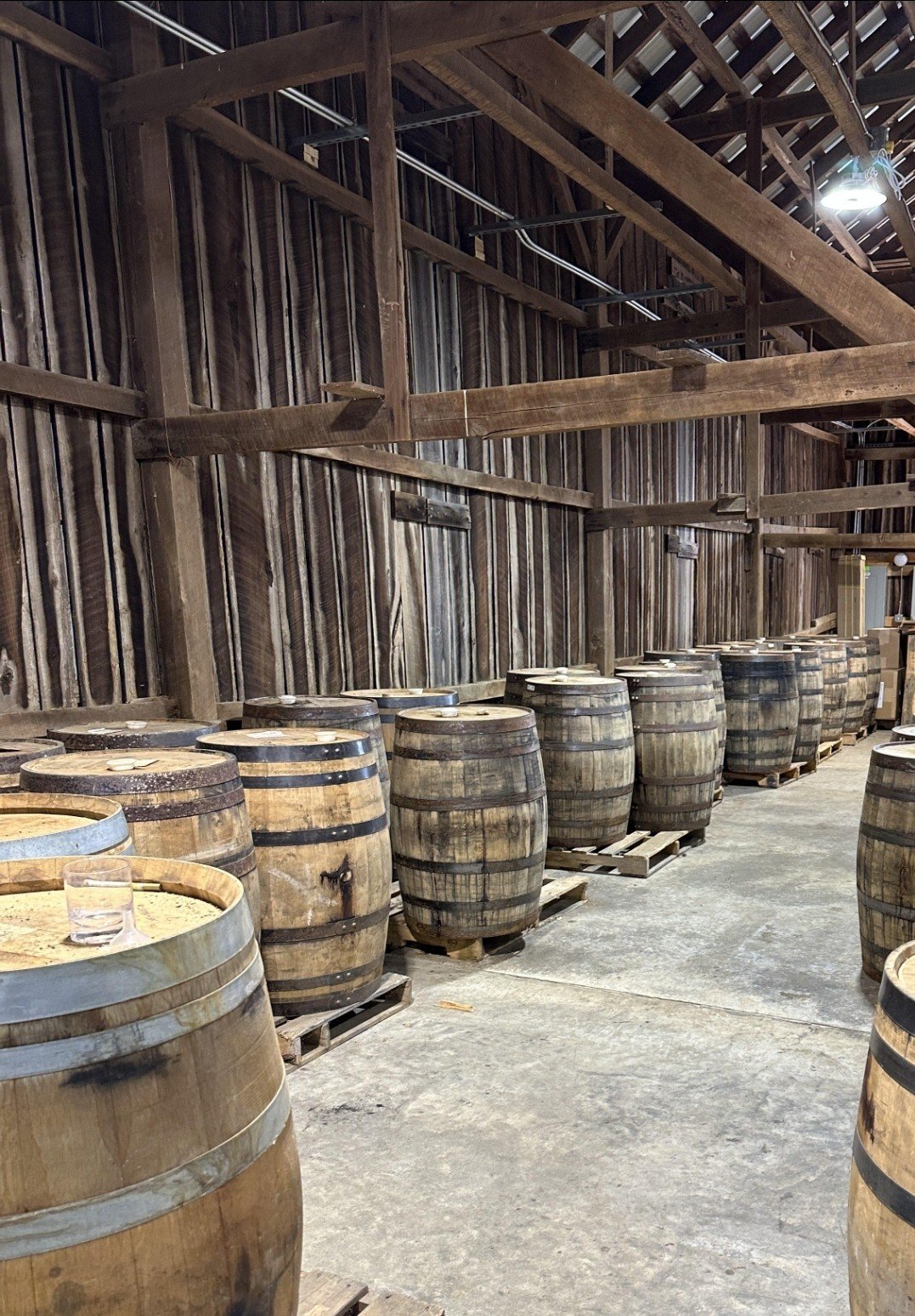 Whiskey barrels inside the LF Heritage Distilling blending barn